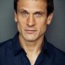 Simon Merrells is Julian