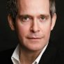 Tom Hollander is Quentin