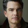 Peter Gallagher is Arthur Campbell