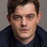 Sam Riley is Douglas Archer