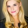 Lucy Durack is Roxy Karibas